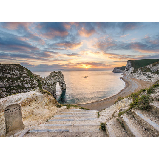 Steps leading down to a serene beach on the Isle with a natural arch rock formation at sunset captured by Available Light Photography's Durdle Door.