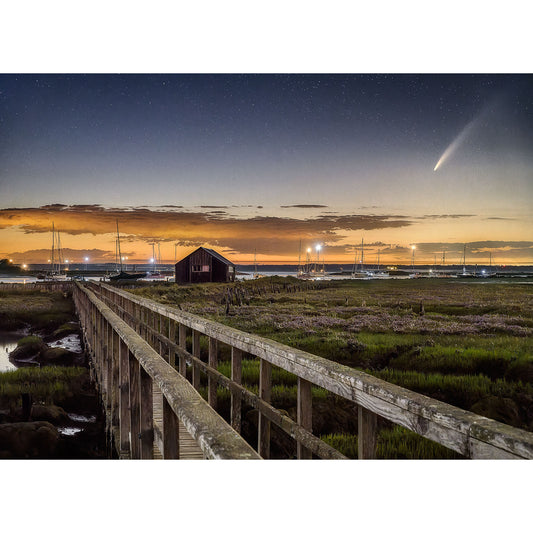 A wooden bridge leading to a small building on the Isle of Wight coast at night with Neowise Comet visible in the starry sky, captured by Available Light Photography.