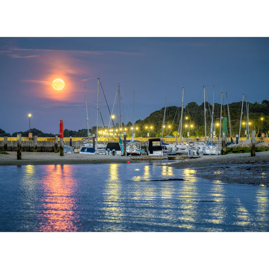 Full Blue Supermoon rising over a tranquil Ryde Marina with boats docked at twilight on Isle of Wight, captured by Available Light Photography.