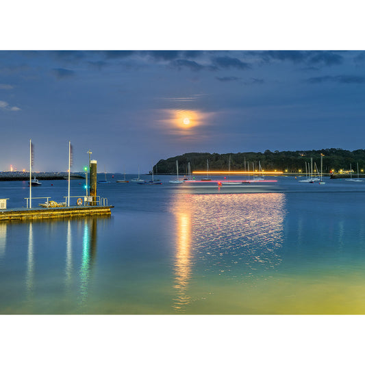 Full Moonrise over East Cowes by Available Light Photography rising over a tranquil marina on the Isle of Wight with reflections on the water surface.