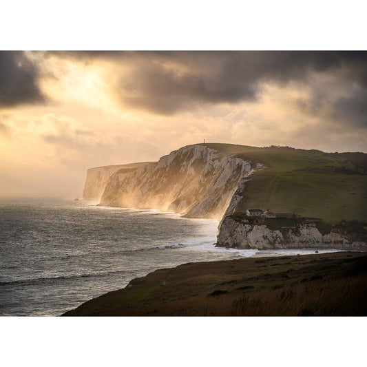 Sunlight casting over coastal cliffs at sunset on Tennyson Down, by Available Light Photography.