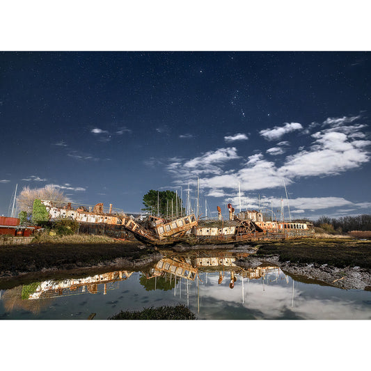 Decaying shipwrecks under a starlit sky with reflections in the water, observed by Steve using The Ryde Queen by Available Light Photography.