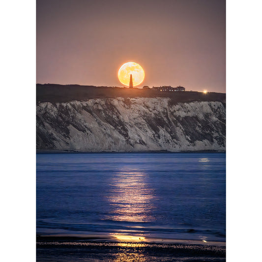 Full Moonrise setting behind Culver Cliff with reflection on the sea surface at Wight captured by Available Light Photography.