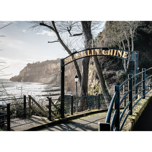 Entrance to Shanklin Beach on the Isle of Wight with a coastal cliff in the background on a bright day by Available Light Photography.