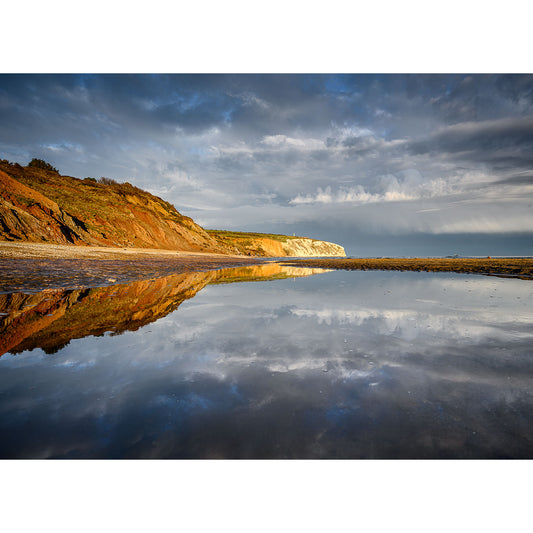 Culver Cliff reflected in a tranquil water pool under a dramatic sky. Image number: 2830 by Available Light Photography.