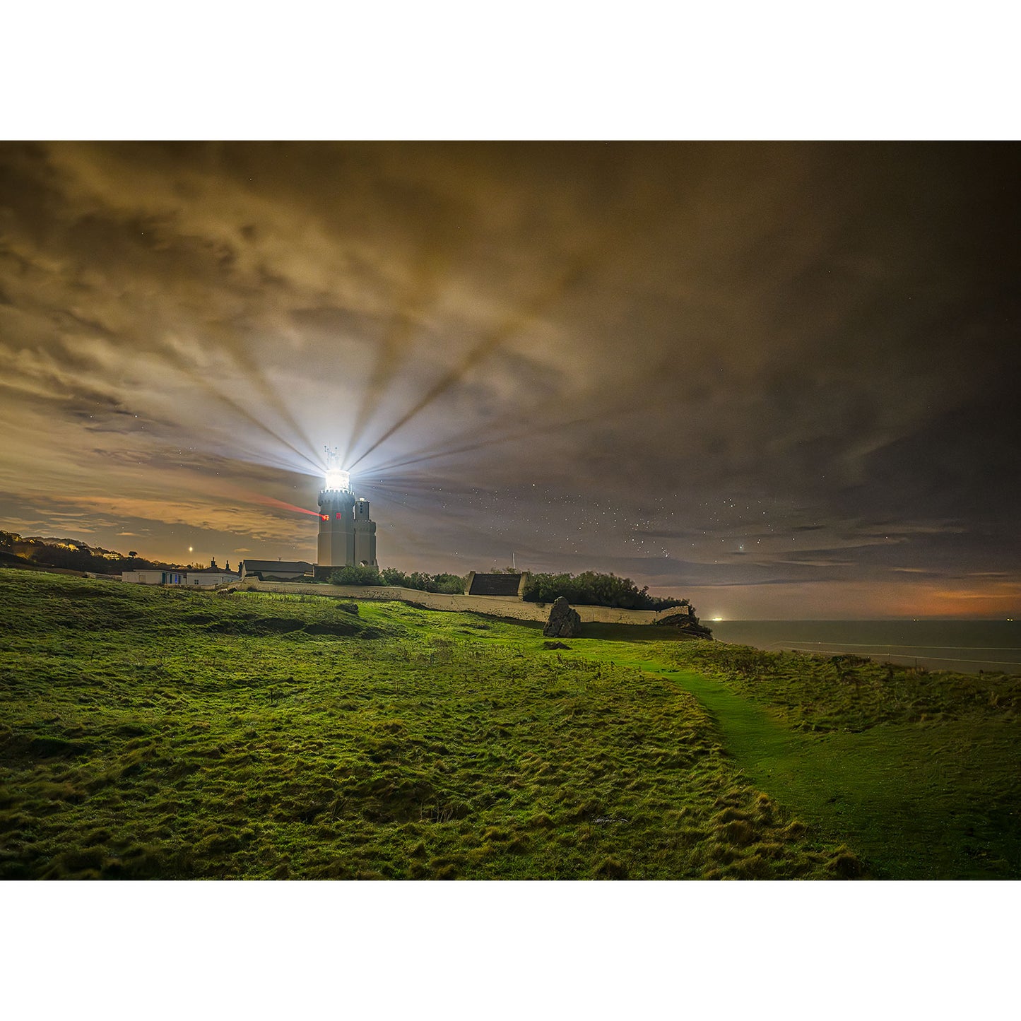 Image number 3102 by Available Light Photography showcases St. Catherine's Lighthouse with its beacon shining brightly from the top.