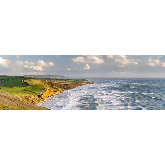 Panoramic view of Compton Bay with cliffs and waves breaking on the shore by Available Light Photography.