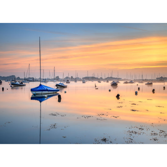 Tranquil Bembridge Harbour at sunrise with boats, calm water reflections by Available Light Photography.