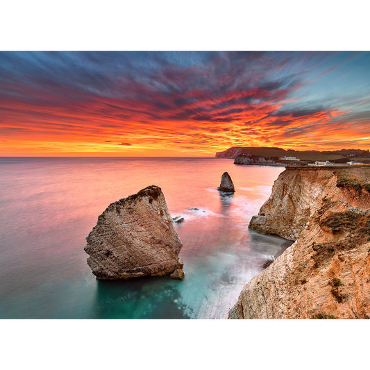 Coastal sunset with vivid skies and rocky cliffs on Freshwater Bay by Available Light Photography.