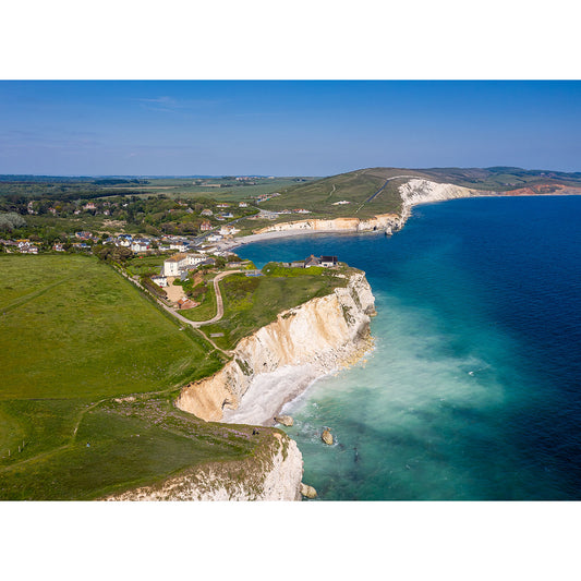 Aerial view of Freshwater Bay, a coastal village on the Isle with white chalk cliffs overlooking a turquoise sea, captured by Available Light Photography.