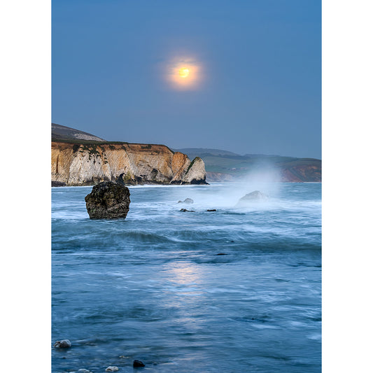 Moonrise, Freshwater Bay coastal landscape with sea spray and cliffs at twilight on the Isle of Wight by Available Light Photography.