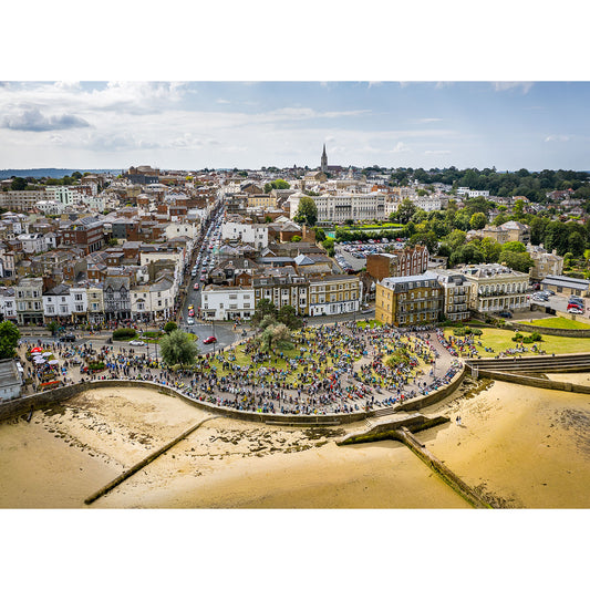 Aerial view of a crowded urban beachfront with a curved promenade from the Scooter Rally, Ryde by Available Light Photography on the Isle of Wight.