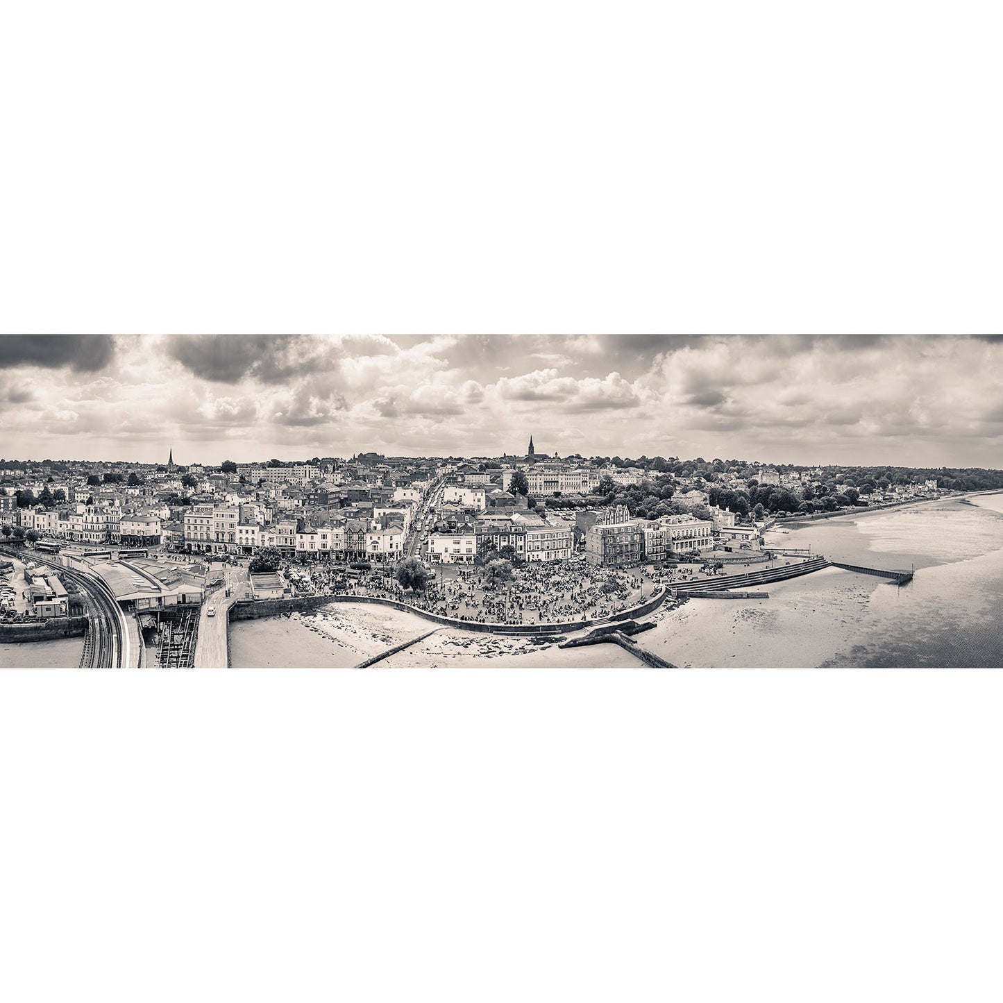 Panoramic view of a European cityscape by the river on an overcast day, capturing the essence of the Isle captured by Available Light Photography's Scooter Rally, Ryde.