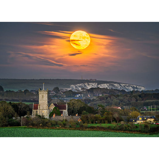 Full Moonrise over Culver Cliff and Godshill Church and rolling hills at dusk on the Isle of Wight captured by Available Light Photography.