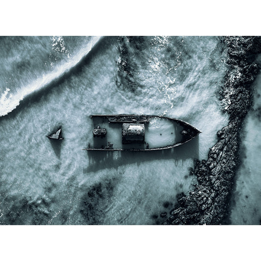 Aerial view of SS Carbon shipwreck partially submerged near the Isle of Wight shoreline taken by Available Light Photography.