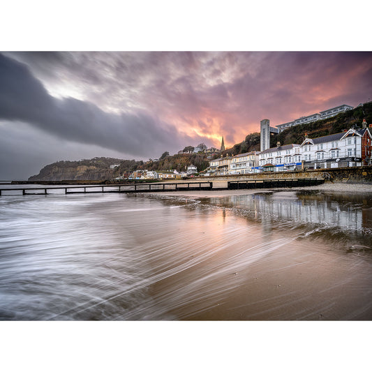 Image number 2811: Shanklin Beach over a coastal town with reflections on the water's surface captured by Available Light Photography.