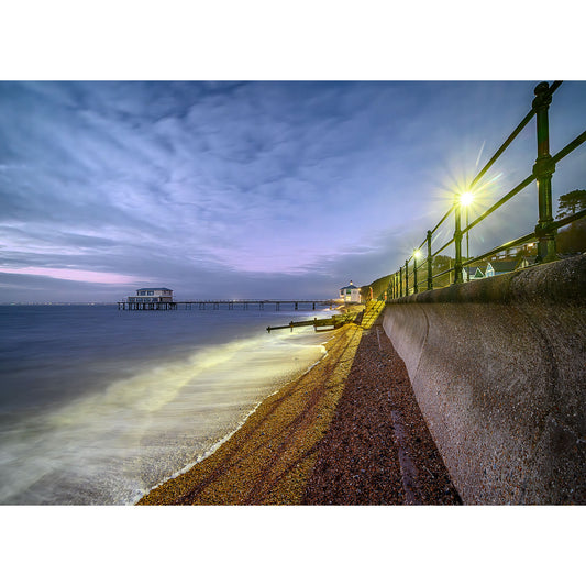 Twilight at a coastal promenade, capturing Totland Image 2819 with a long exposure view of a calm sea, railing, and a distant pier by Available Light Photography.