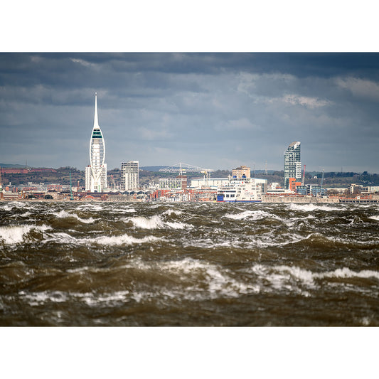 Image number 2825: City skyline with a prominent spire-like building seen across Choppy Seas at The Spinnaker Tower under a cloudy sky, captured by Available Light Photography.