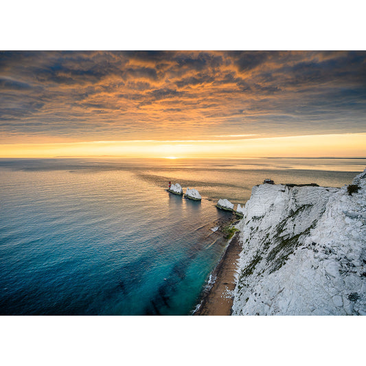 Sunset over a calm sea with white cliffs on the right and a ship near the coast under a cloudy sky captured by Available Light Photography. Image number: 2764 featuring The Needles.