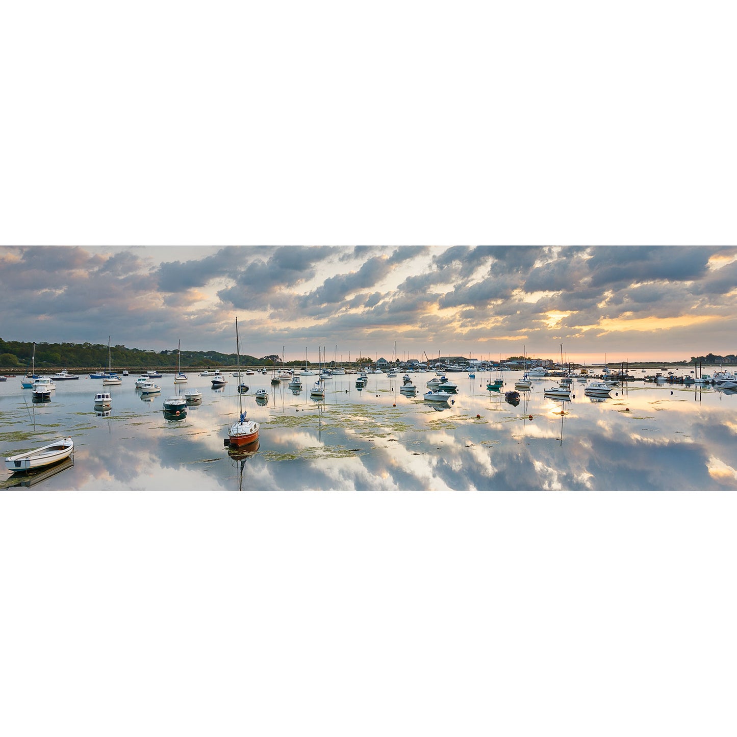 Sailboats moored in Bembridge Harbour at sunset with reflective water near Wight, captured by Available Light Photography.