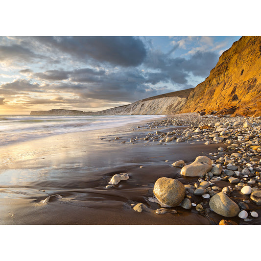 Sunset at Compton Bay on the Isle of Wight with cliffs illuminated by the golden light, captured by Available Light Photography.