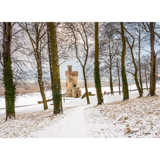 Snow-dusted path leading through a row of bare trees to the Appley Tower by Available Light Photography on the Isle of Wight.
