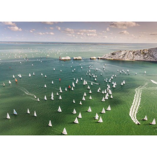 Aerial view of the Round the Island Race sailing regatta with numerous sailboats competing on a clear day near the Isle of Wight, captured by Available Light Photography.