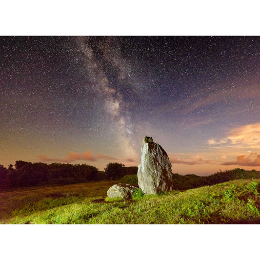 A standing stone under a starry sky on the Isle of Wight, with the Milky Way visible, captured by Available Light Photography's The Longstone.