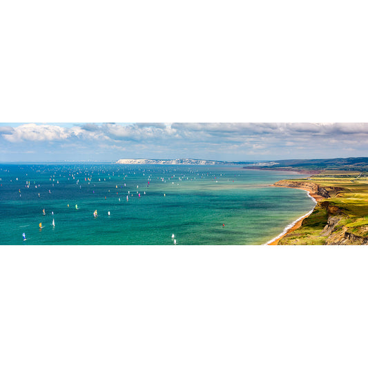 Panoramic view of the coastal seascape at Gascoigne Isle with numerous sailboats and a clear sky captured by Available Light Photography's Round the Island Race.