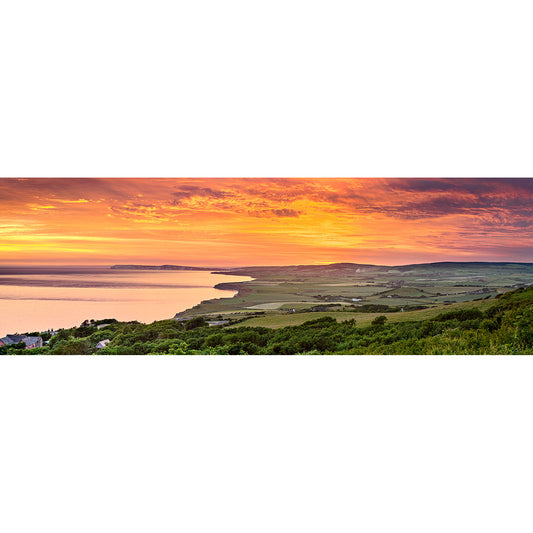 Panoramic view of a coastal landscape on the Isle of Wight with the Sunset over West Wight by Available Light Photography.
