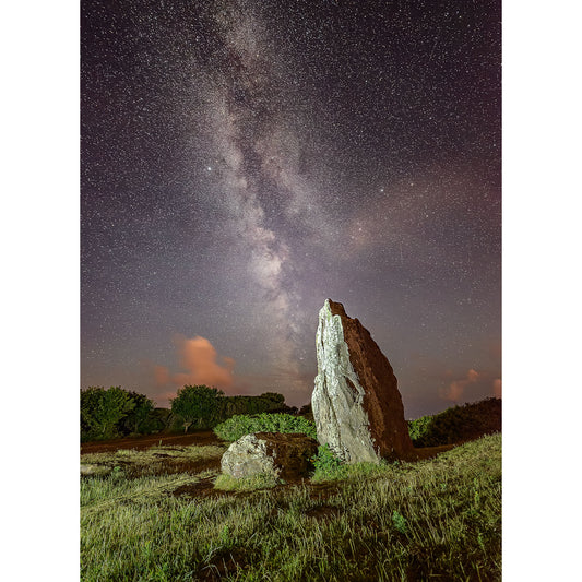 A standing stone on the Isle of Wight under a starry night sky with the Milky Way visible, captured by Available Light Photography's The Longstone.