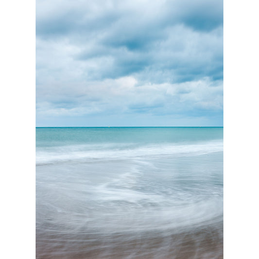 Serene seascape with soft waves under a cloudy sky, near the Isle of Gascoigne captured in "Into the Blue II" by Available Light Photography.