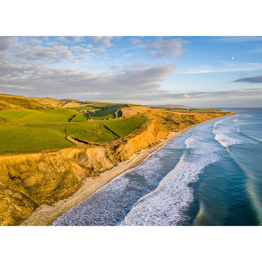 Aerial view of Compton Bay, a coastal landscape with cliffs, green fields, and waves washing ashore at sunset in Wight by Available Light Photography.