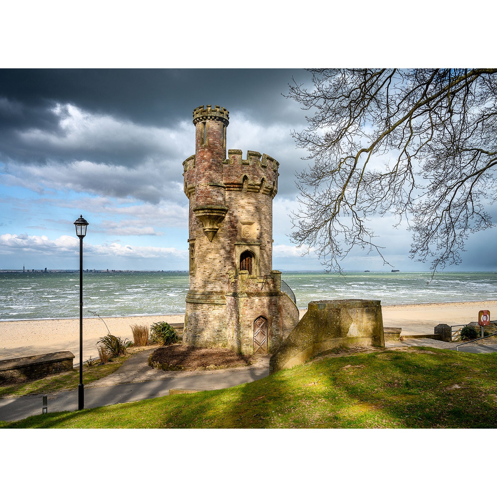 Historic Appley Tower along a coastal shoreline on the Isle of Wight under a cloudy sky, captured by Available Light Photography.