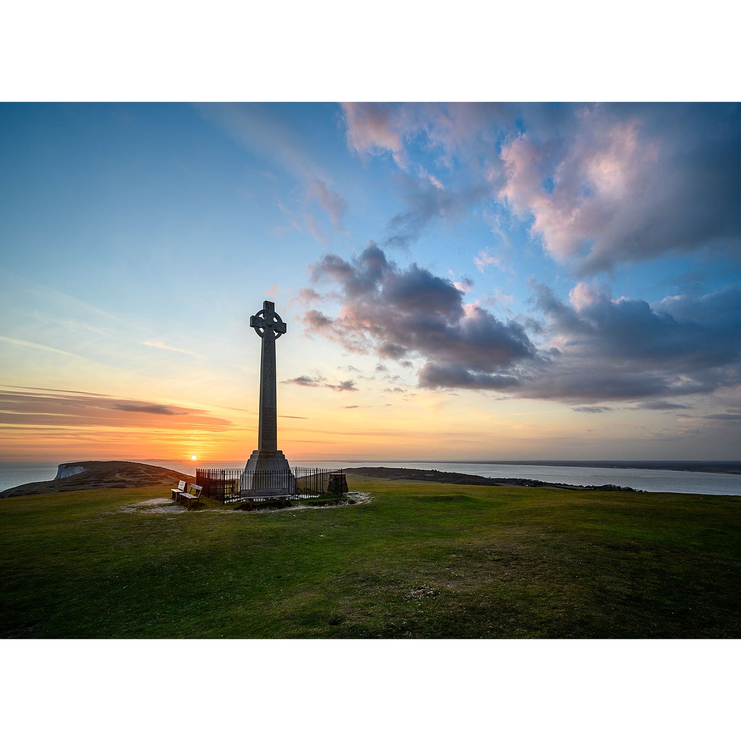 Sunset at the Tennyson Monument on Gascoigne Isle with expansive sky and scattered clouds by Available Light Photography.