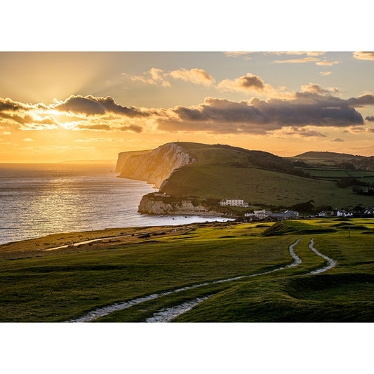 Golden sunset over rolling coastal hills with a chalk cliff by the sea on Tennyson Down by Available Light Photography.