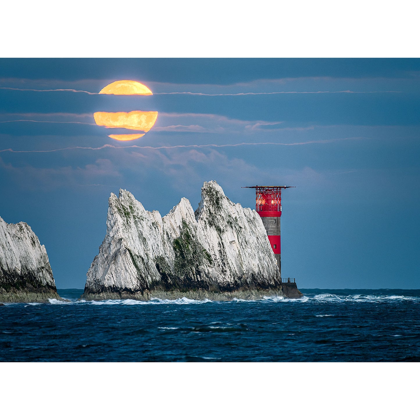 Full Moonset over The Needles rising beside coastal cliffs on the Isle of Wight, captured by Available Light Photography.