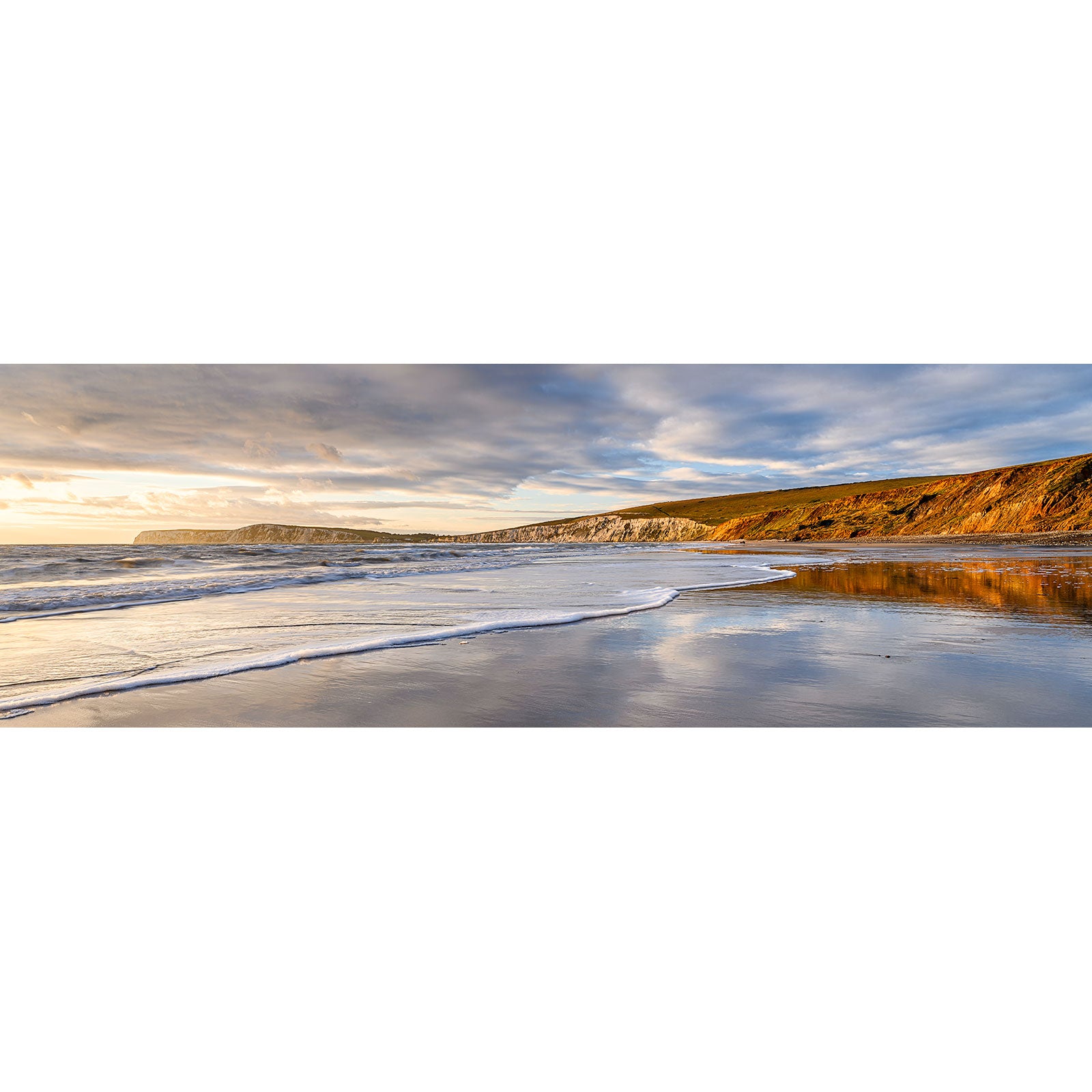 A panoramic view of Compton Bay, a serene beach at sunset with waves gently lapping the shore and a cliff in the distance, evoking the tranquil scenes captured by Steve.