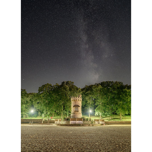 A Milky Way above an illuminated Appley Tower on the Isle of Wight, surrounded by trees, captured by Available Light Photography.