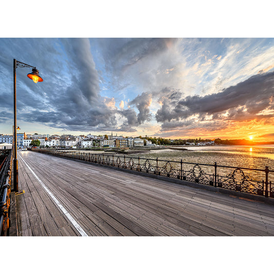 Boardwalk with a view of a scenic sunset over a river and city skyline on the Isle, captured by Ryde Pier from Available Light Photography.